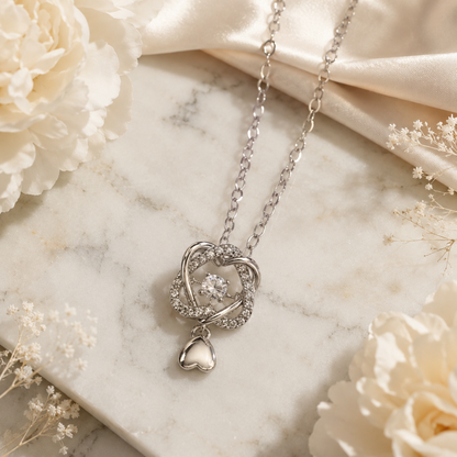Eternal Spark Crystal Love-Knot Heart Pendant Necklace for Women & Girls | Premium Silver-Tone Stainless Steel Statement Jewellery for Daily Wear, Party Wear & Gifting